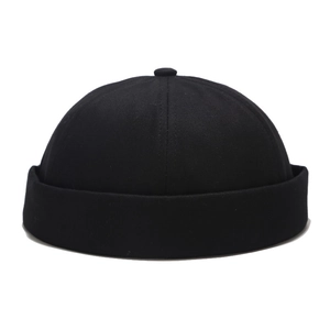 Close-up of black cotton docker hat showing twill fabric texture and rolled brim detail