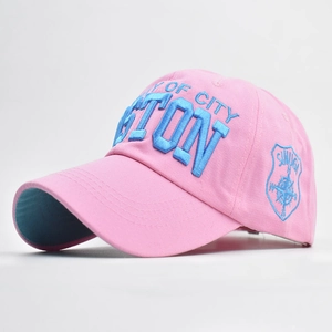 Detail of pink cotton baseball cap with blue 3D Boston embroidery and side shield patch