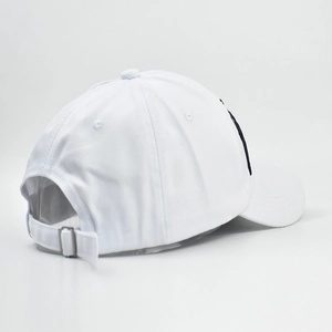 Detail of white cotton baseball cap showing adjustable silver metal buckle and strap