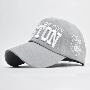 Close-up of 3D embroidered Boston logo on grey cotton twill baseball cap with curved brim