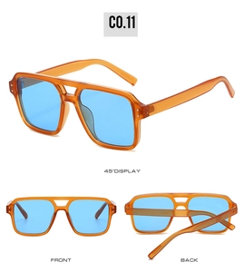 Detail view of vintage aviator sunglasses with orange frames and blue lenses