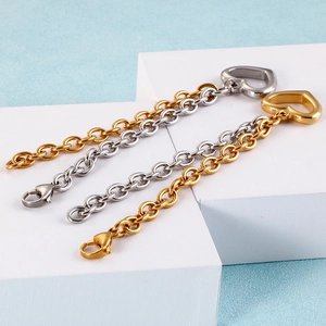 Minimalist hollow heart bracelets in gold and silver finish on a display stand