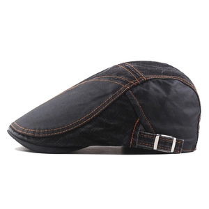 Vintage black denim flat cap with contrast orange stitching and adjustable side buckles
