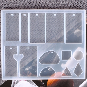 Macro detail of transparent silicone mold for resin pendants with multi-shape tag cavities