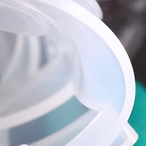 Detailed close-up of translucent silicone resin mold with spiral texture for DIY jewelry