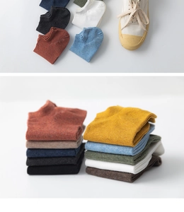 Detailed knit texture and color palette of cotton low cut socks for men in various tones