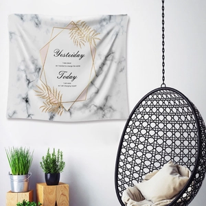 Detail of marble tapestry with golden fern leaves and inspirational quotes on wall