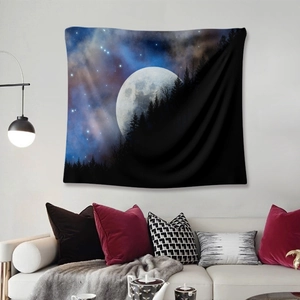 Modern living room featuring a mystical forest and full moon tapestry as wall decor