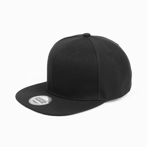 Detail of a black snapback cap featuring cotton twill texture and silver visor sticker