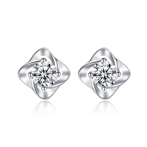 Elegant S999 sterling silver four-leaf clover stud earrings with sparkling white zircon