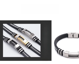 Detail of men's punk stainless steel bracelet with leather cord and magnetic metal clasp