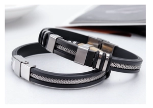 Detail of black silicone bracelets featuring silver stainless steel mesh and buckle