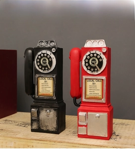 Macro view of vintage 1957 style resin telephone with detailed dial and coin slot