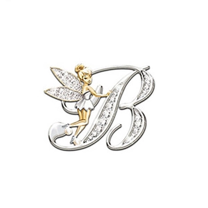 Detail of gold letter B brooch with sparkling crystals and a delicate fairy charm