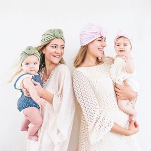 Knot turban beanies for mother and baby in light green and pastel pink colors