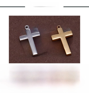 Detailed view of stainless steel cross pendants in gold and silver with dimensions