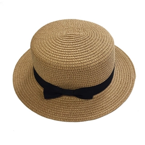 French vintage flat top straw hat with black bow ribbon and tight woven texture