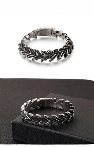 Close-up of 316L stainless steel bracelet with armor-style mechanical scale design