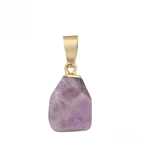 Macro shot of natural amethyst pendant with irregular geometric cuts and golden metal clasp
