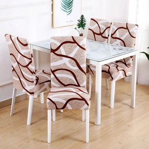Detail view of stretch chair covers with beige and brown wavy geometric pattern