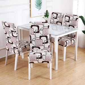 Detail of stretch chair cover with beige and brown geometric patterns for modern dining room