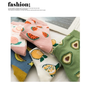 Detailed view of colorful cotton socks with vibrant knit fruit patterns like lemon and peach