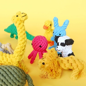 Close-up of assorted hand-woven colorful cotton rope pet chew toys in animal shapes