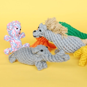 Detailed texture of colorful cotton rope pet toys in various animal shapes