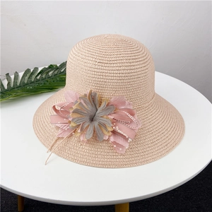 Elegant beige straw sun hat for women featuring 3D floral accents and ribbon