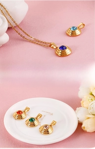 Macro shot of colorful zircon round pendants with gold-plated multi-layer nesting structure