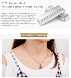 Detailed view of 316L stainless steel silver chain with round red zircon pendant charm