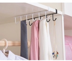Detail of multi-functional under-shelf cabinet hooks holding scarves and neckties