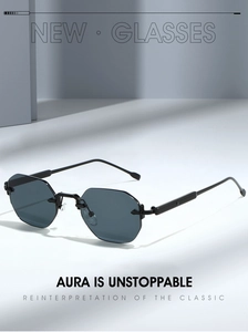 Detail of octagonal rimless sunglasses with dark grey lenses and black metal temples