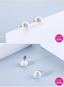 Detailed view of minimalist cross pearl earrings with silver butterfly clasps