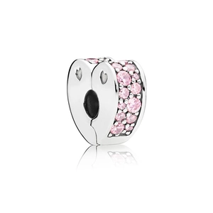 Silver heart-shaped charm with pink crystals and hollow design on white background