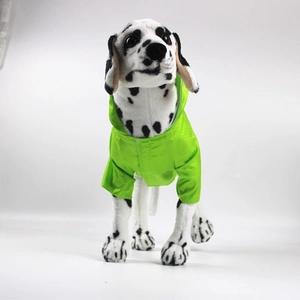 Detail of neon green waterproof dog raincoat with a clear view of the protective coating