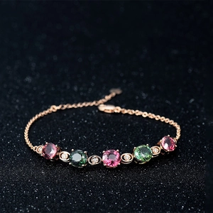 Elegant rose gold bracelet featuring vibrant round multi-colored crystals and diamond accents