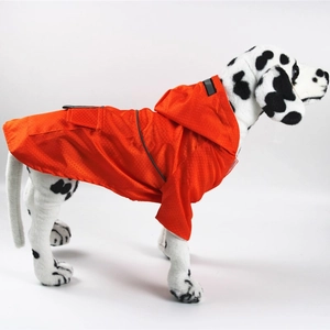 Detail of waterproof orange pet raincoat fabric with reflective strip and honeycomb pattern