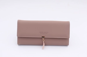 Close-up of contrast stitching, gold buckle and leaf charm on mauve long wallet