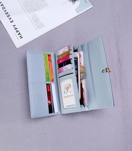 Detailed interior of women long wallet featuring multiple card slots and zip coin pocket