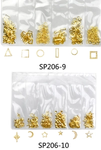 Detail view of gold alloy metal nail art studs in various geometric shapes for manicure
