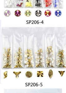 Detailed view of assorted metal nail charms and colorful star rhinestones in bulk sets