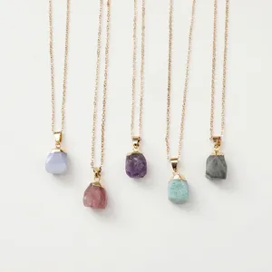 Natural raw gemstone necklaces in pink and purple crystals with golden metal chains
