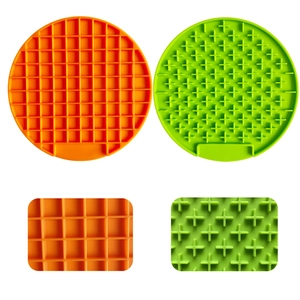 Silicone slow feeder lick mat set for dogs with suction cups in orange and green