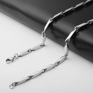 Detail view of silver stainless steel long bar link chain with a lobster clasp closure