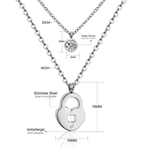 Detail of silver double-layer stainless steel necklace with heart lock and zircon pendant