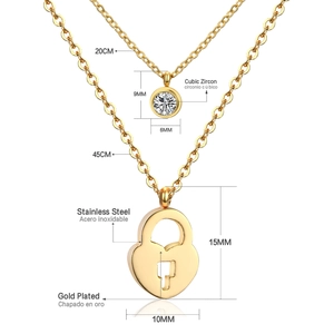 Detailed close-up of double-layer stainless steel gold necklace with heart lock and zircon