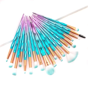 Macro detail of 20pcs unicorn diamond makeup brushes with gradient handles and soft bristles