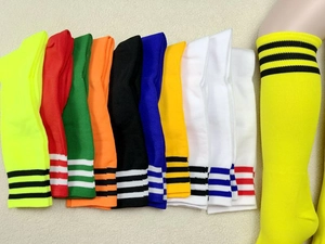 Various colorful striped soccer socks with a mannequin wearing the neon yellow pair