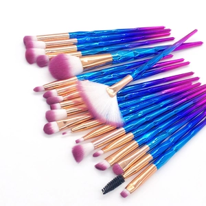 Detail of 20pcs makeup brush set with diamond cut gradient handles and rose gold ferrules